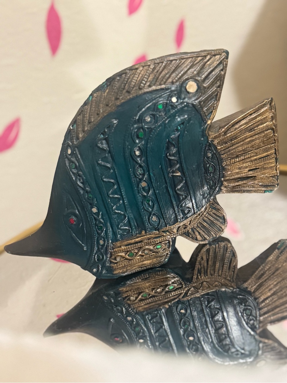 hand-carved wooden fish figurine with an intricate vintage-inspired design.